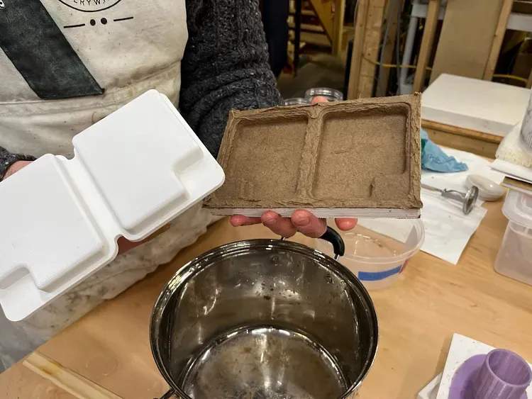 Molding paper pulp packaging prototypes.
